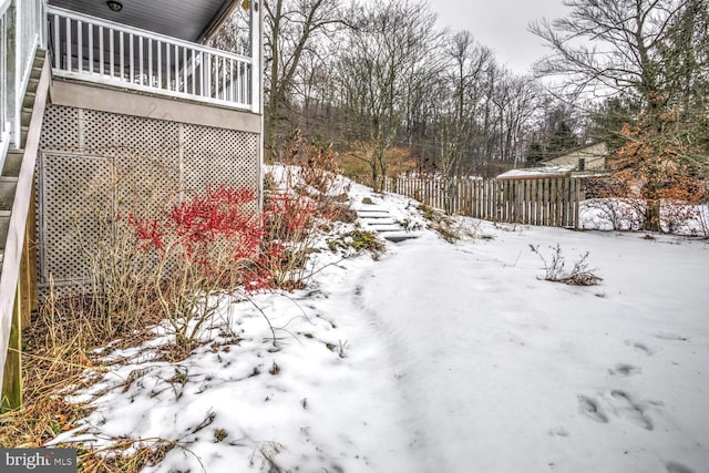 view of yard layered in snow