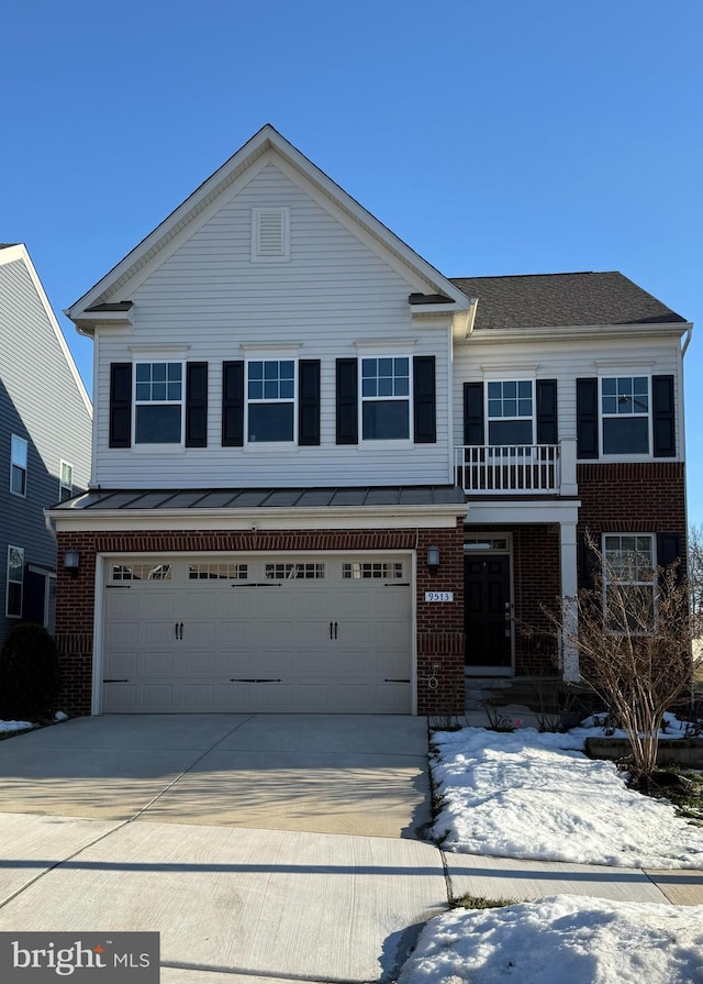 front of property with a balcony and a garage