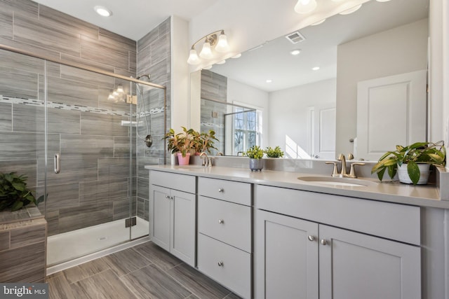 bathroom featuring vanity and walk in shower