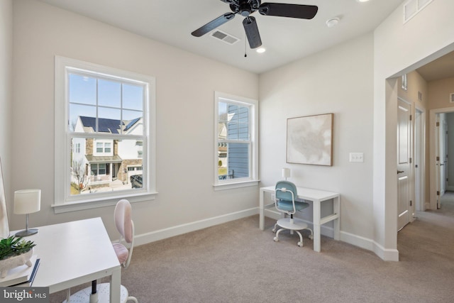 office featuring light carpet and ceiling fan