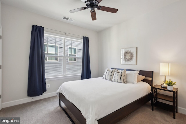 bedroom with light carpet and ceiling fan