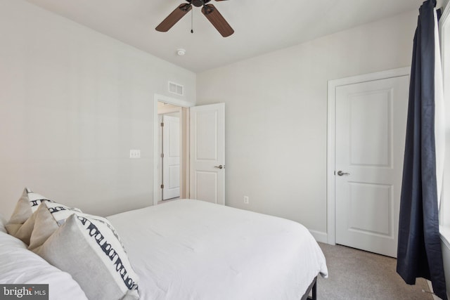 carpeted bedroom with ceiling fan