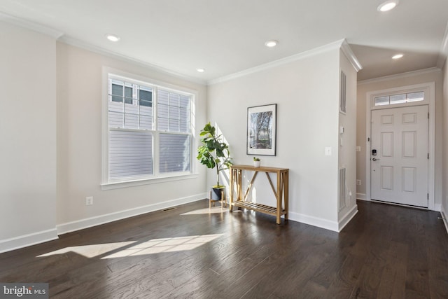 foyer featuring ornamental molding and dark hardwood / wood-style floors