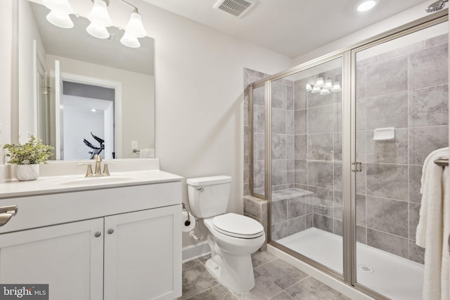 bathroom featuring vanity, toilet, and walk in shower