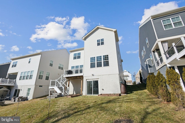 rear view of property with a yard