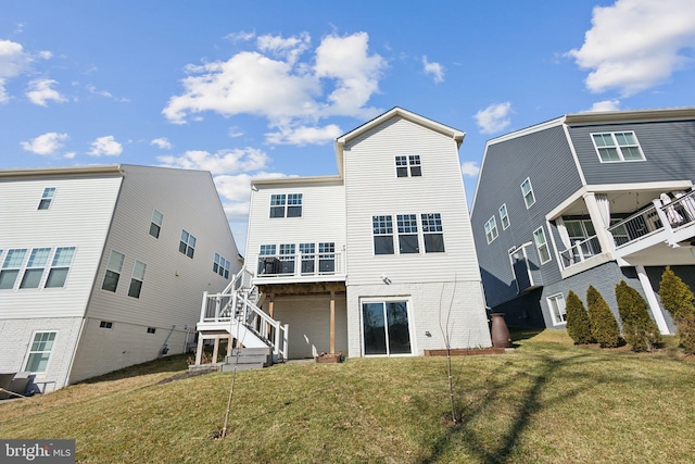 rear view of property featuring a yard