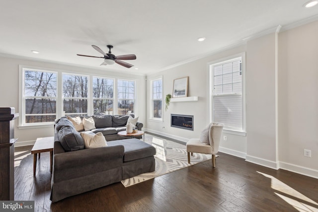 living room featuring crown molding, dark hardwood / wood-style floors, and ceiling fan