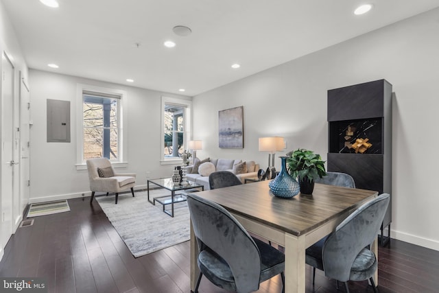 dining room with dark wood-type flooring and electric panel