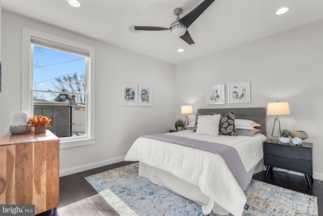 bedroom with dark wood-type flooring and ceiling fan