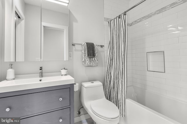 full bathroom featuring vanity, shower / tub combo, and toilet