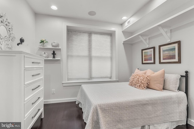 bedroom with dark wood-type flooring