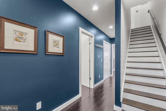 stairway featuring hardwood / wood-style flooring