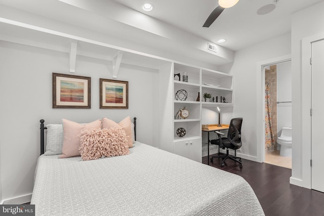 bedroom featuring dark hardwood / wood-style flooring, connected bathroom, beamed ceiling, and ceiling fan