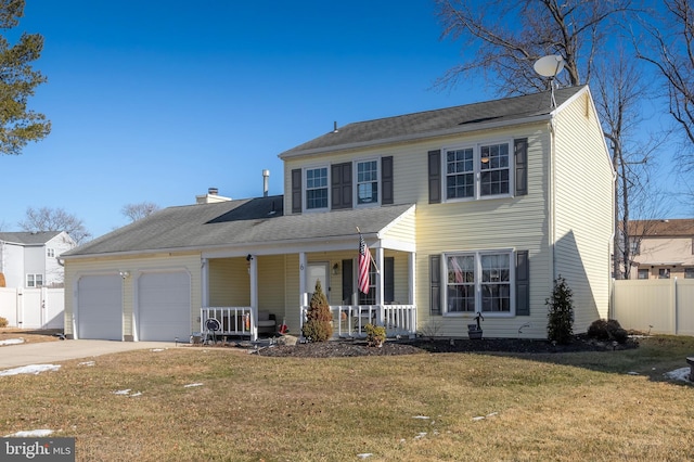 colonial inspired home featuring a porch, a garage, and a front yard