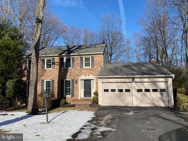 colonial-style house featuring a garage