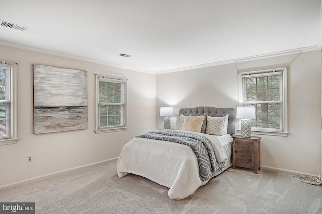 carpeted bedroom featuring crown molding