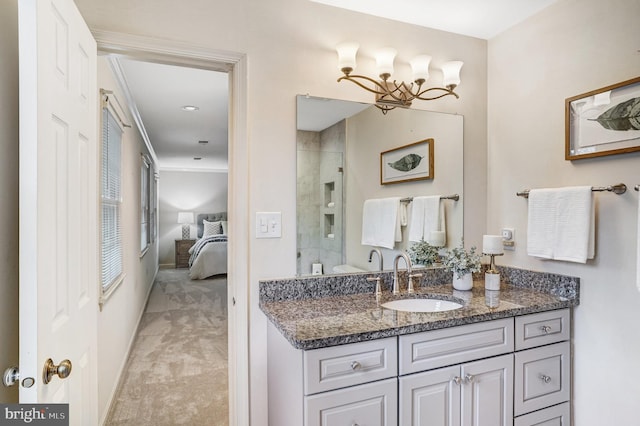 bathroom with a shower with door and vanity