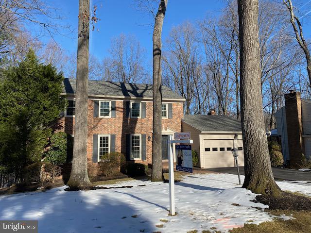 colonial inspired home featuring a garage