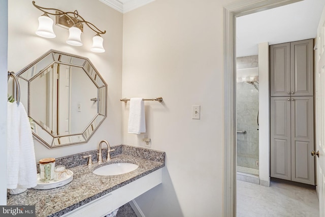 bathroom featuring sink, crown molding, and a shower with door