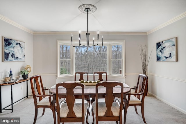 carpeted dining space featuring crown molding, a healthy amount of sunlight, and a notable chandelier