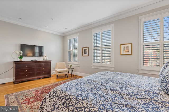 bedroom featuring hardwood / wood-style flooring and ornamental molding