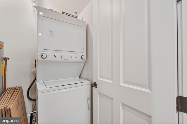 laundry room featuring stacked washer and clothes dryer