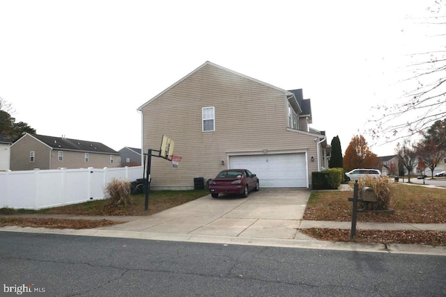 view of property exterior with a garage