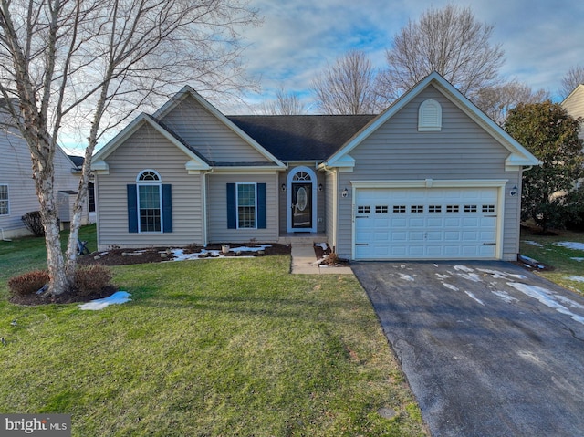 single story home featuring a garage and a front lawn