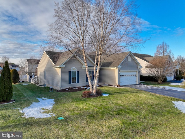 single story home featuring a garage and a front yard