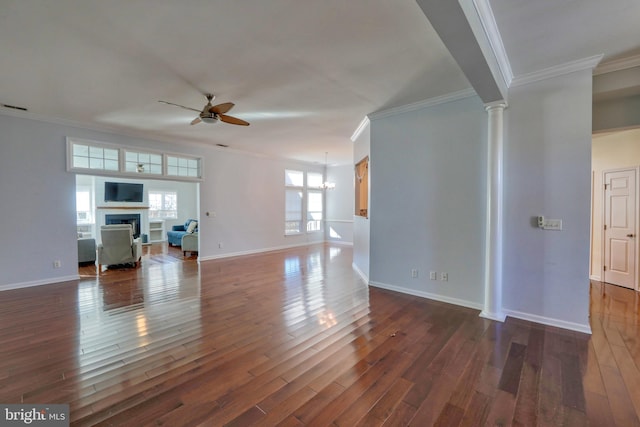 unfurnished living room featuring ceiling fan, ornamental molding, and decorative columns