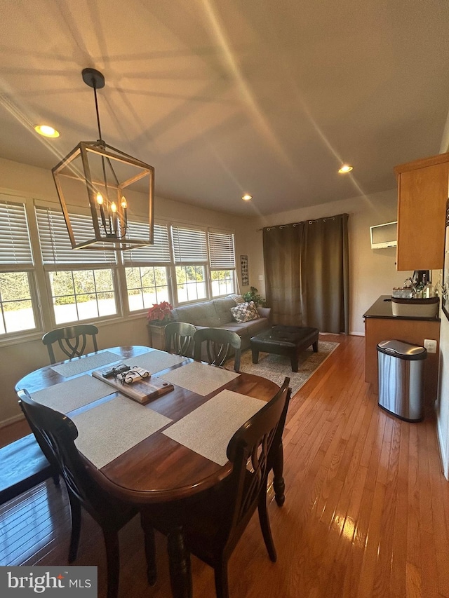 dining room featuring a chandelier and light hardwood / wood-style floors