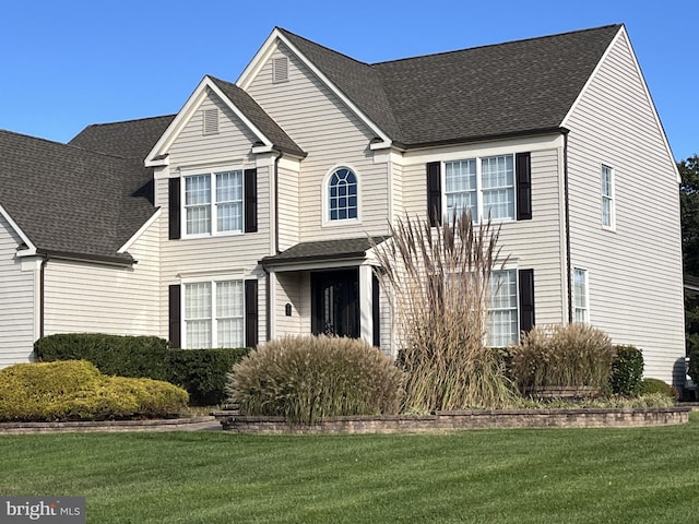 view of front of home with a front lawn