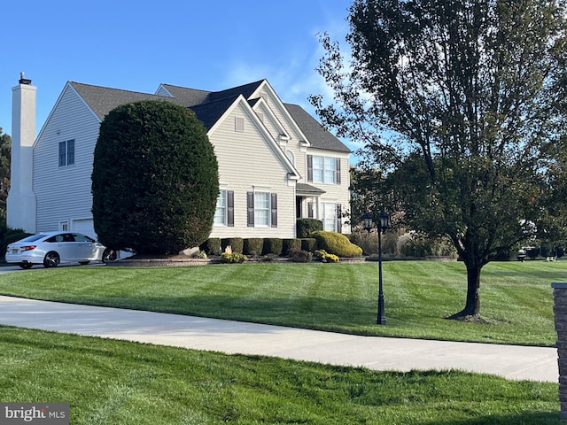 view of home's exterior featuring a yard