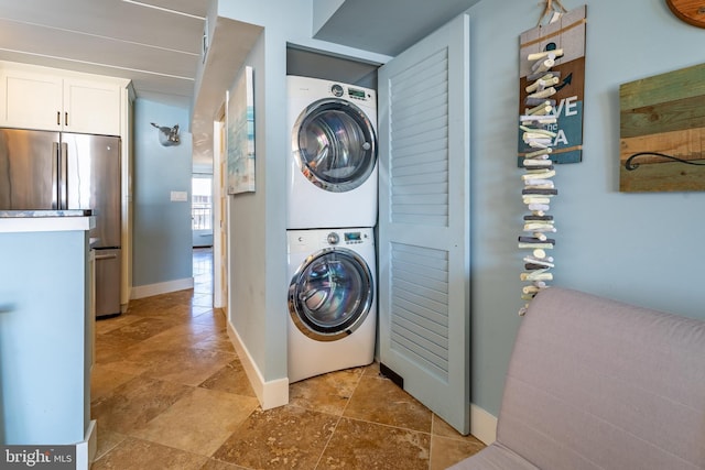 washroom with stacked washer and dryer