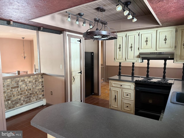 kitchen featuring a baseboard heating unit, hanging light fixtures, a tray ceiling, black appliances, and kitchen peninsula