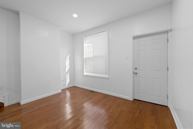 foyer entrance with hardwood / wood-style flooring