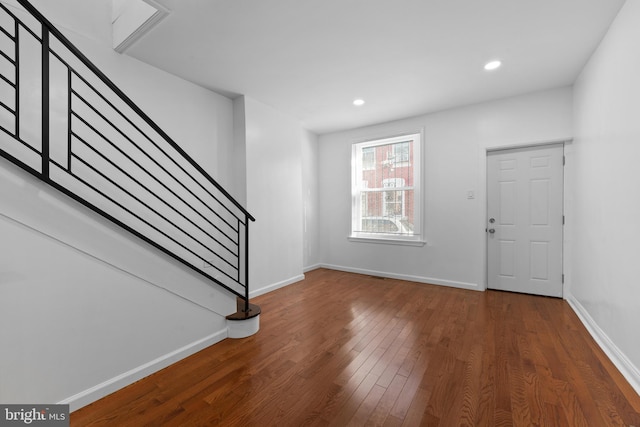 foyer with dark hardwood / wood-style flooring