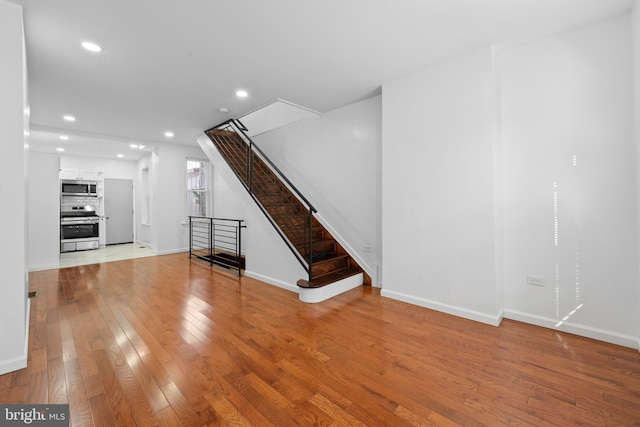 unfurnished living room featuring light hardwood / wood-style floors