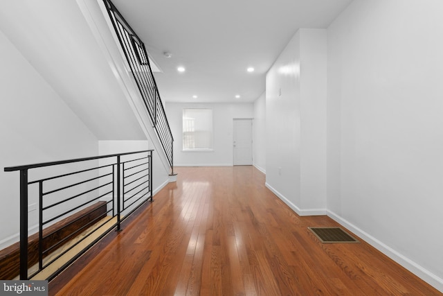 corridor featuring hardwood / wood-style flooring