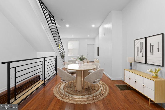 dining space featuring dark hardwood / wood-style flooring