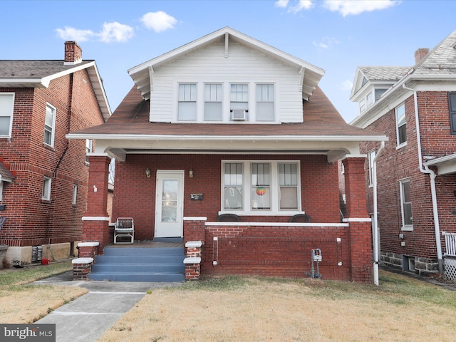 bungalow-style home with covered porch