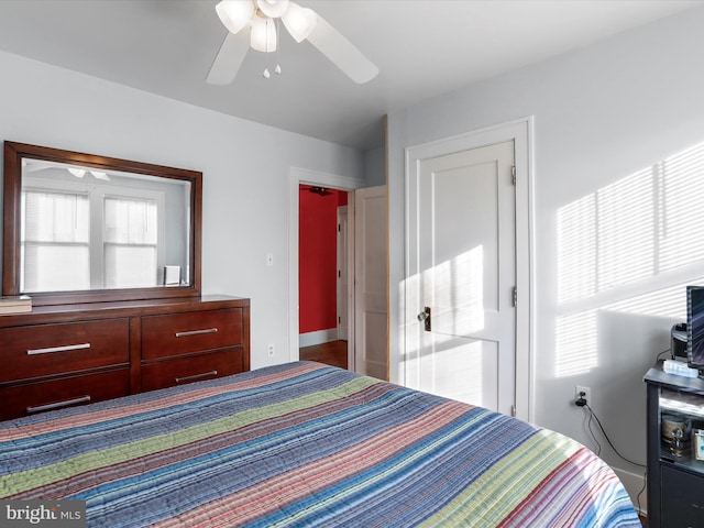 unfurnished bedroom with ceiling fan and multiple windows