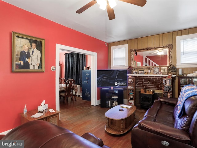 living room with hardwood / wood-style flooring and ceiling fan