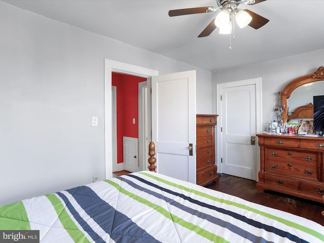 bedroom with dark hardwood / wood-style floors and ceiling fan