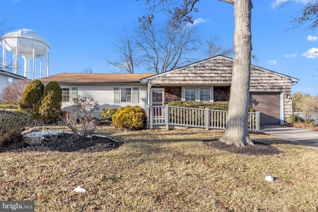 ranch-style house with a garage and a front yard