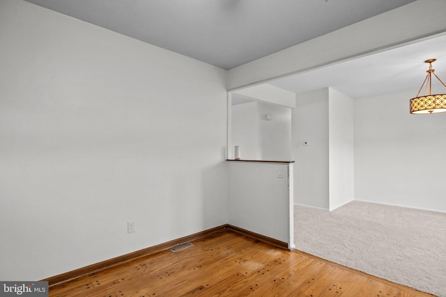 empty room featuring hardwood / wood-style flooring