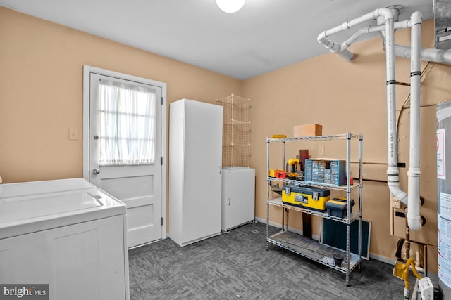 clothes washing area with dark carpet and washing machine and clothes dryer