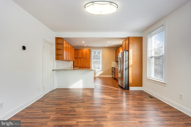 unfurnished living room featuring dark hardwood / wood-style floors