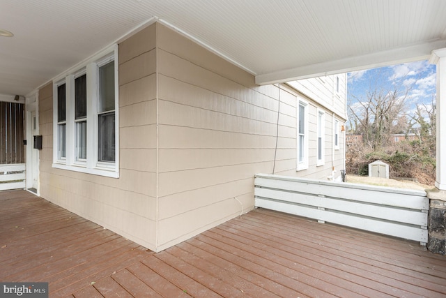 wooden terrace with a storage unit