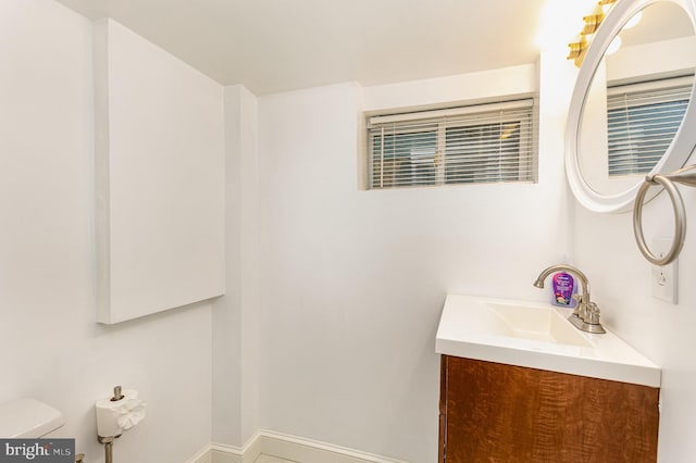 bathroom featuring vanity and toilet